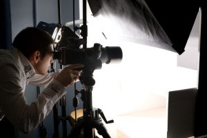 A photographer takes aim at his subject